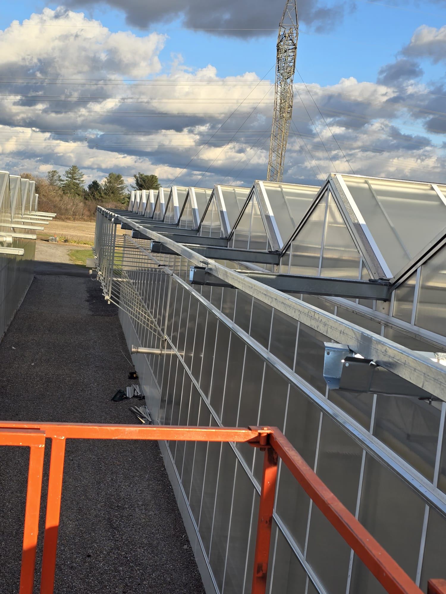 Row of completed commercial greenhouse structures