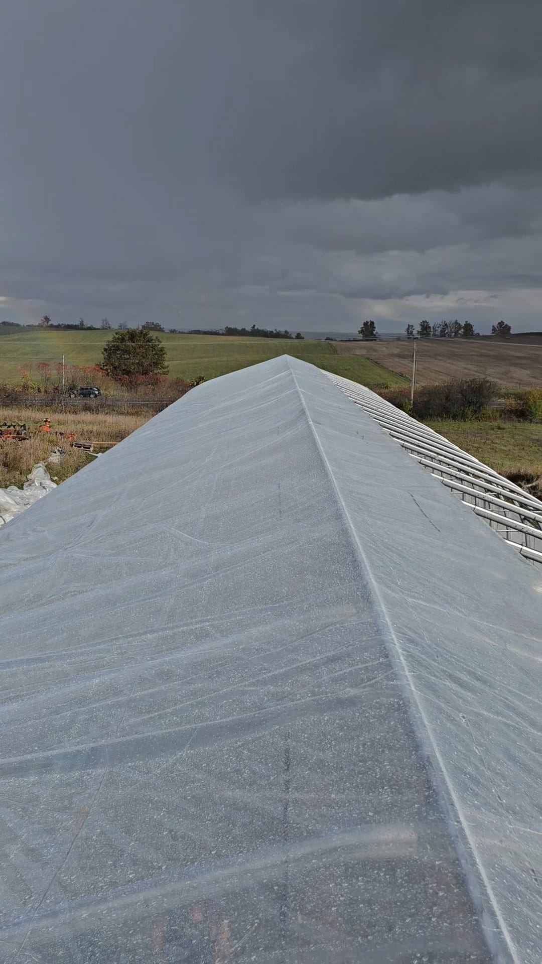 Poly roof ridge line under a dramatic sky