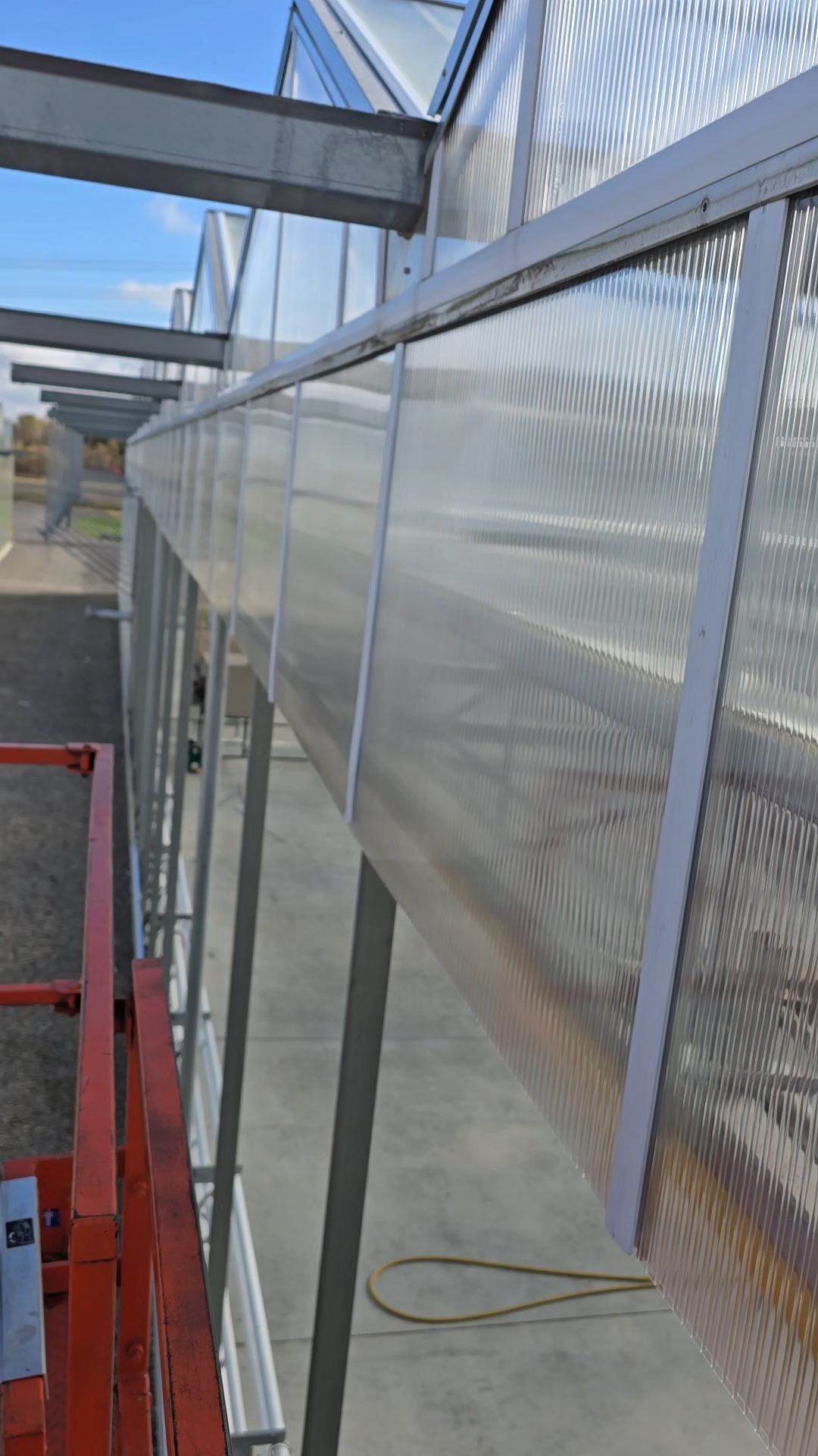 Close-up of a completed polycarbonate wall installation